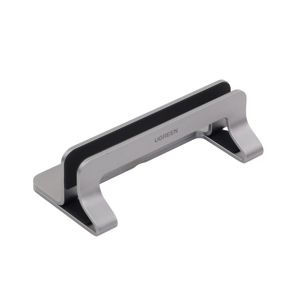 Soporte Vertical para Laptop / Adecuado para escritorio / Anchura Ajustable (12-26mm) / Amplia compatibilidad / Anti-Arañazos / Anti-Deslizante /Ajustable Mediante Tornillos / Color Plata / Aluminio + Silicona