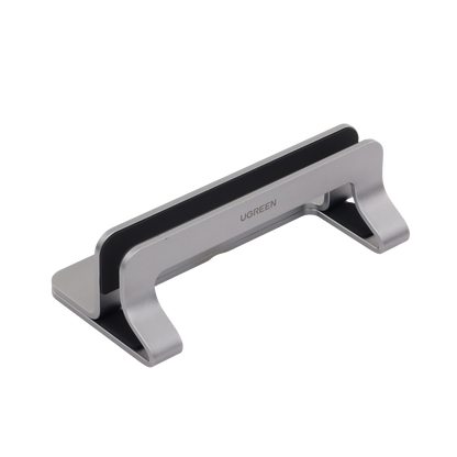 Soporte Vertical para Laptop / Adecuado para escritorio / Anchura Ajustable (12-26mm) / Amplia compatibilidad / Anti-Arañazos / Anti-Deslizante /Ajustable Mediante Tornillos / Color Plata / Aluminio + Silicona