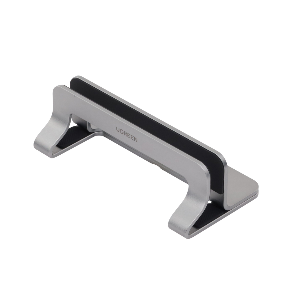 Soporte Vertical para Laptop / Adecuado para escritorio / Anchura Ajustable (12-26mm) / Amplia compatibilidad / Anti-Arañazos / Anti-Deslizante /Ajustable Mediante Tornillos / Color Plata / Aluminio + Silicona