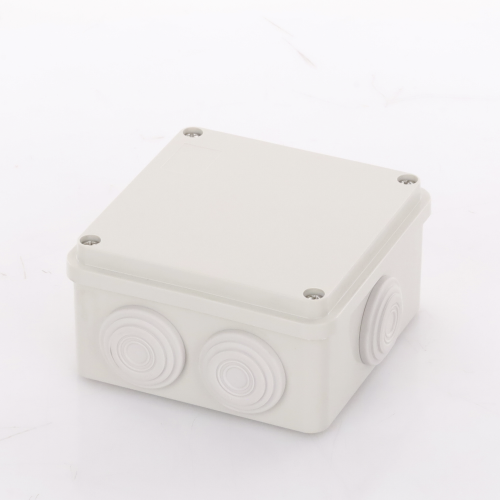 Caja Derivación-Conexión de Plástico (100 X 100 X 54 mm) con 7 Glándulas de Goma. Para Instalaciones Comerciales, Residenciales e Industriales. Incluye Tornillería para su Tapa.