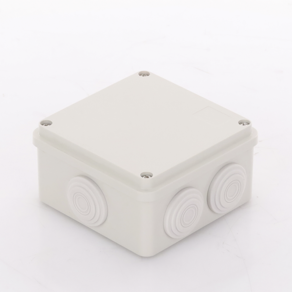 Caja Derivación-Conexión de Plástico (100 X 100 X 54 mm) con 7 Glándulas de Goma. Para Instalaciones Comerciales, Residenciales e Industriales. Incluye Tornillería para su Tapa.